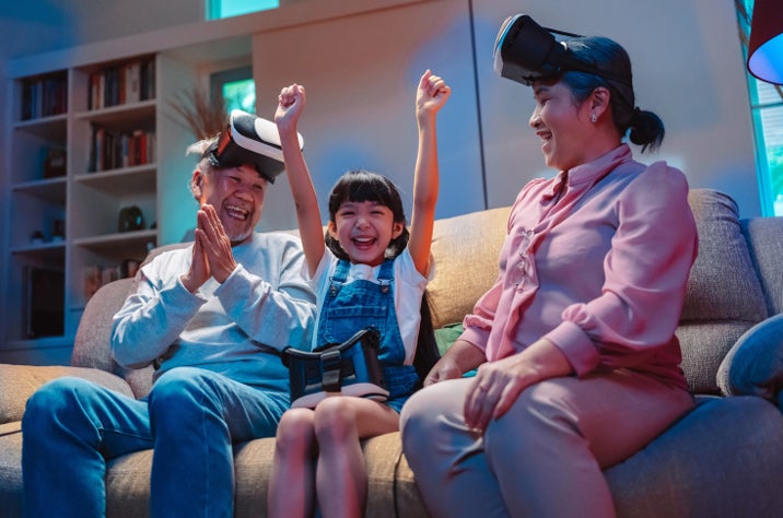 happy family using VR headset