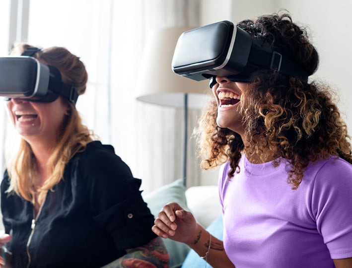 two girls playing virtual reality games