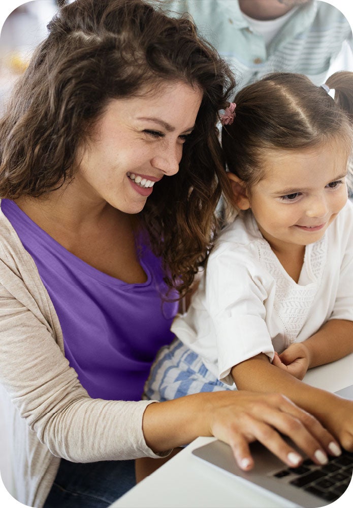 Woman with daughter on laptop