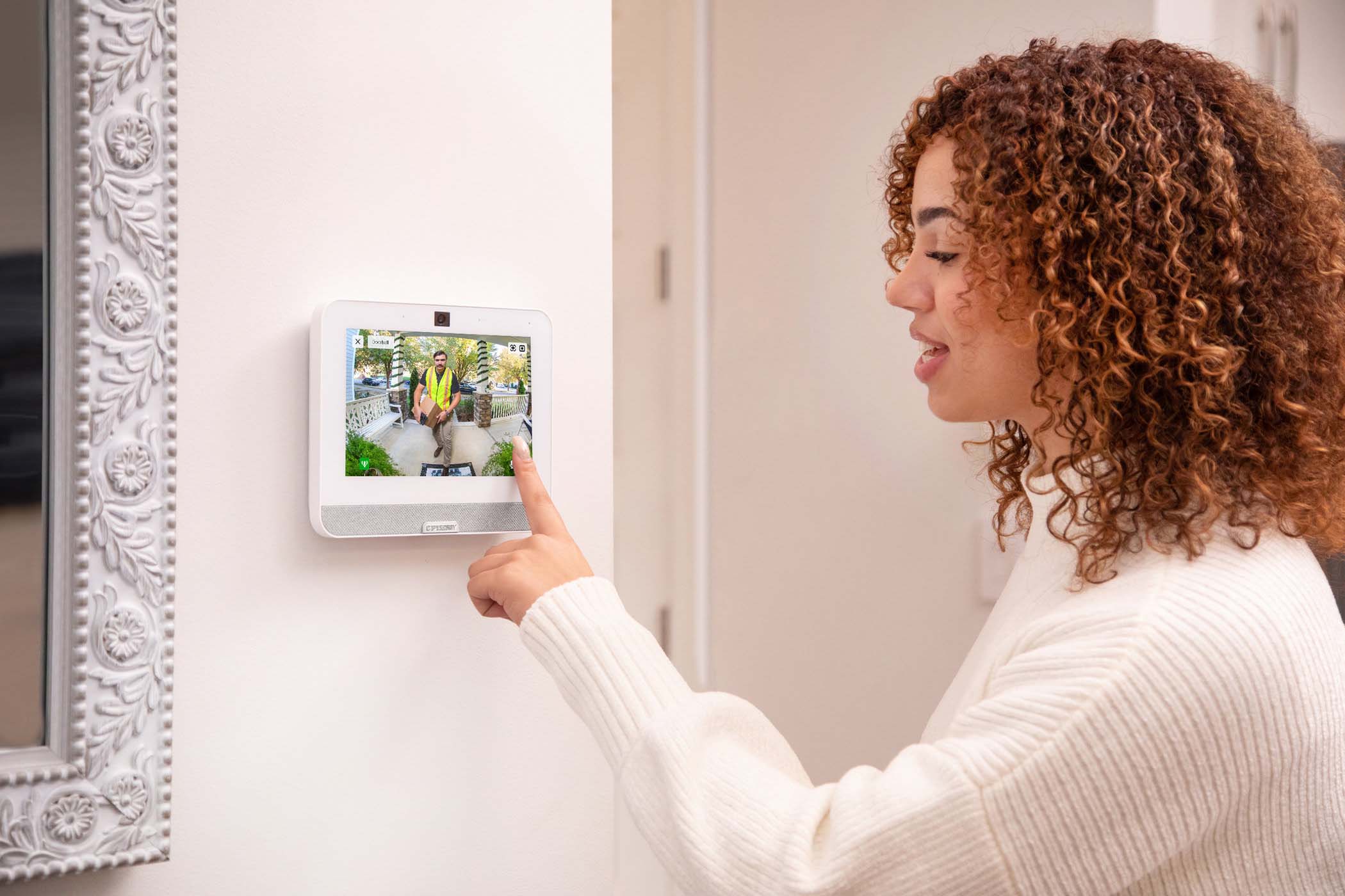 woman checking front door camera