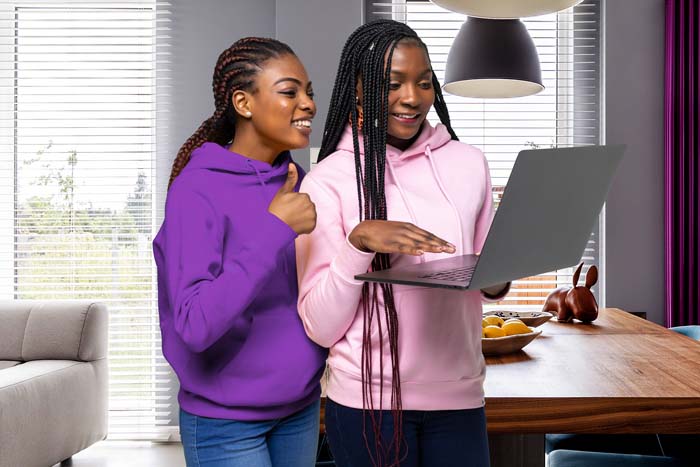 two sisters on a computer