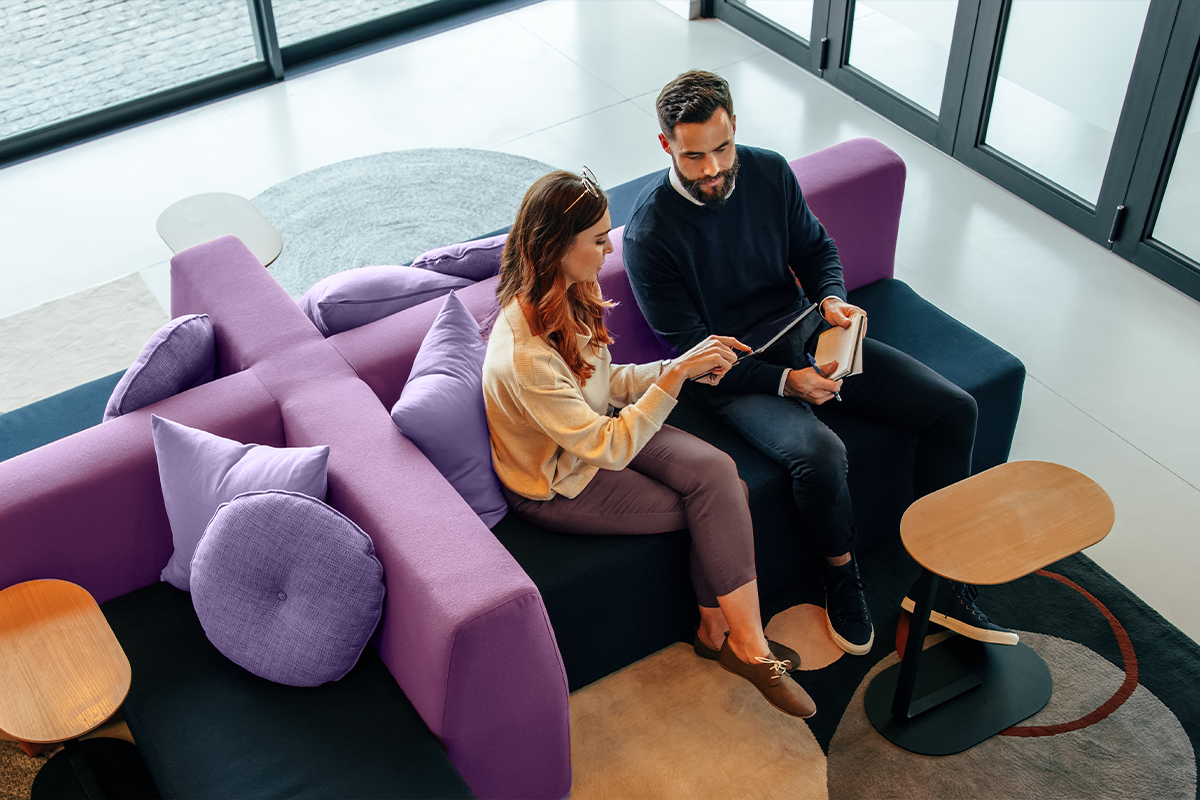 Man and woman sitting on couch
