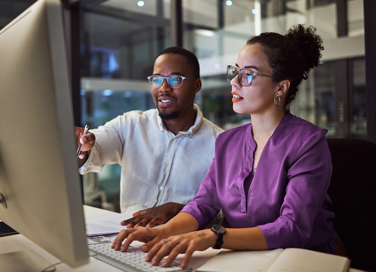 Man and woman on a computer