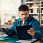 Man looking at tablet